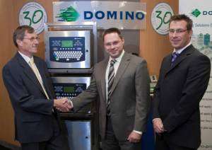 Prism managing director David Aspinall (left), Domino operations purchasing manager Ian Whitehead (centre) and Domino commodity buyer Rob Ellinor (right) pictured with Domino’s best selling A400 ink jet printer.